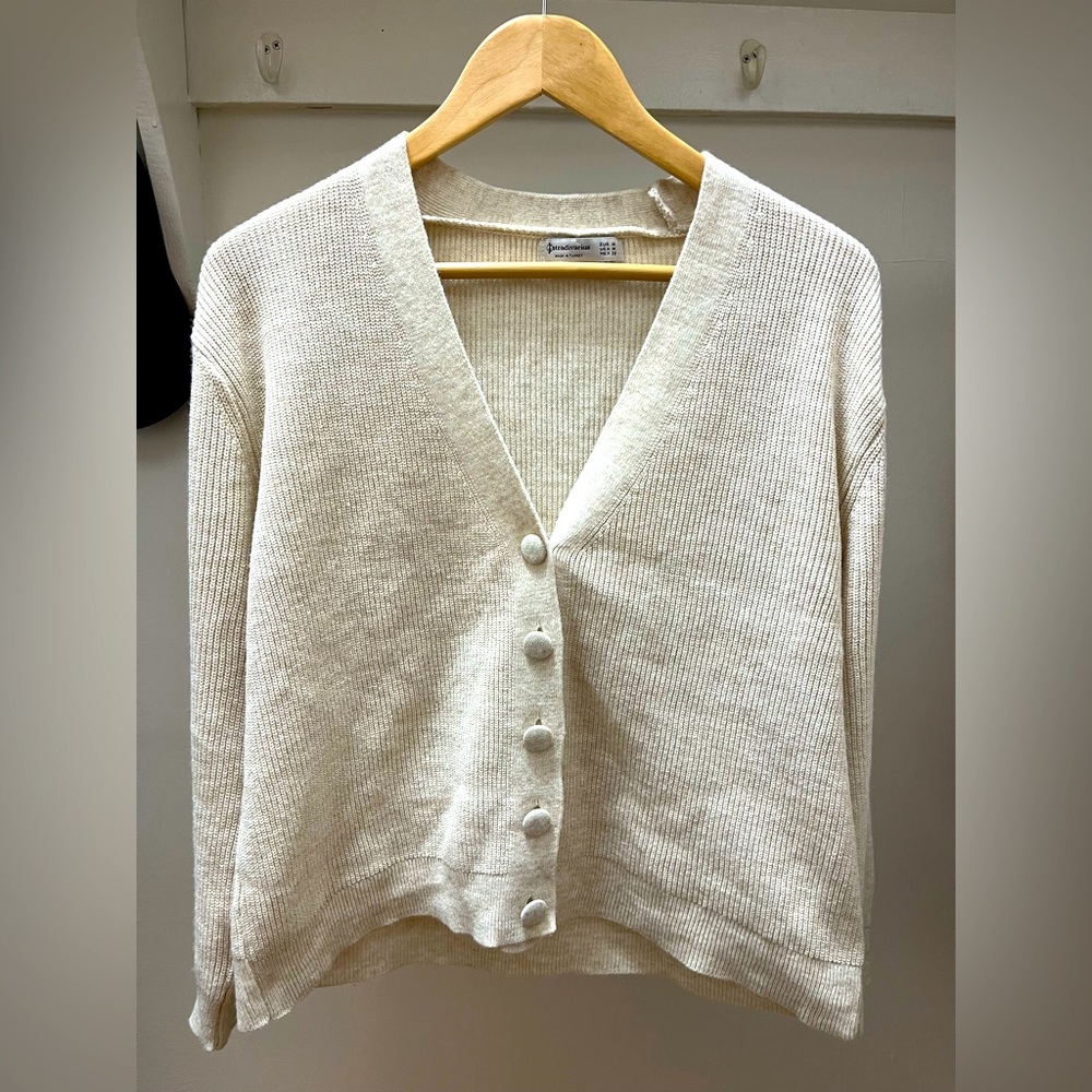 Cream sweater with covered buttons